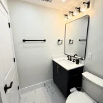 bathroom remodel with dark cabinets